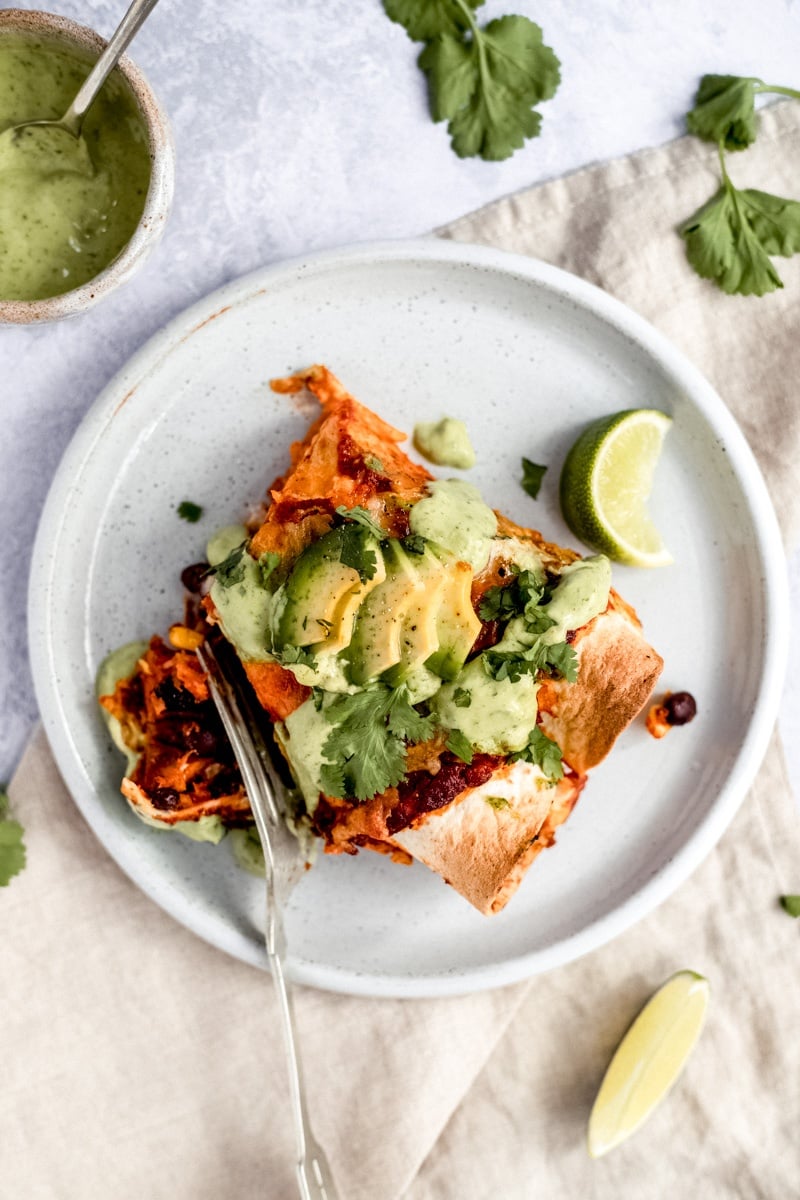 vegetarian sweet potato black bean enchiladas on a plate